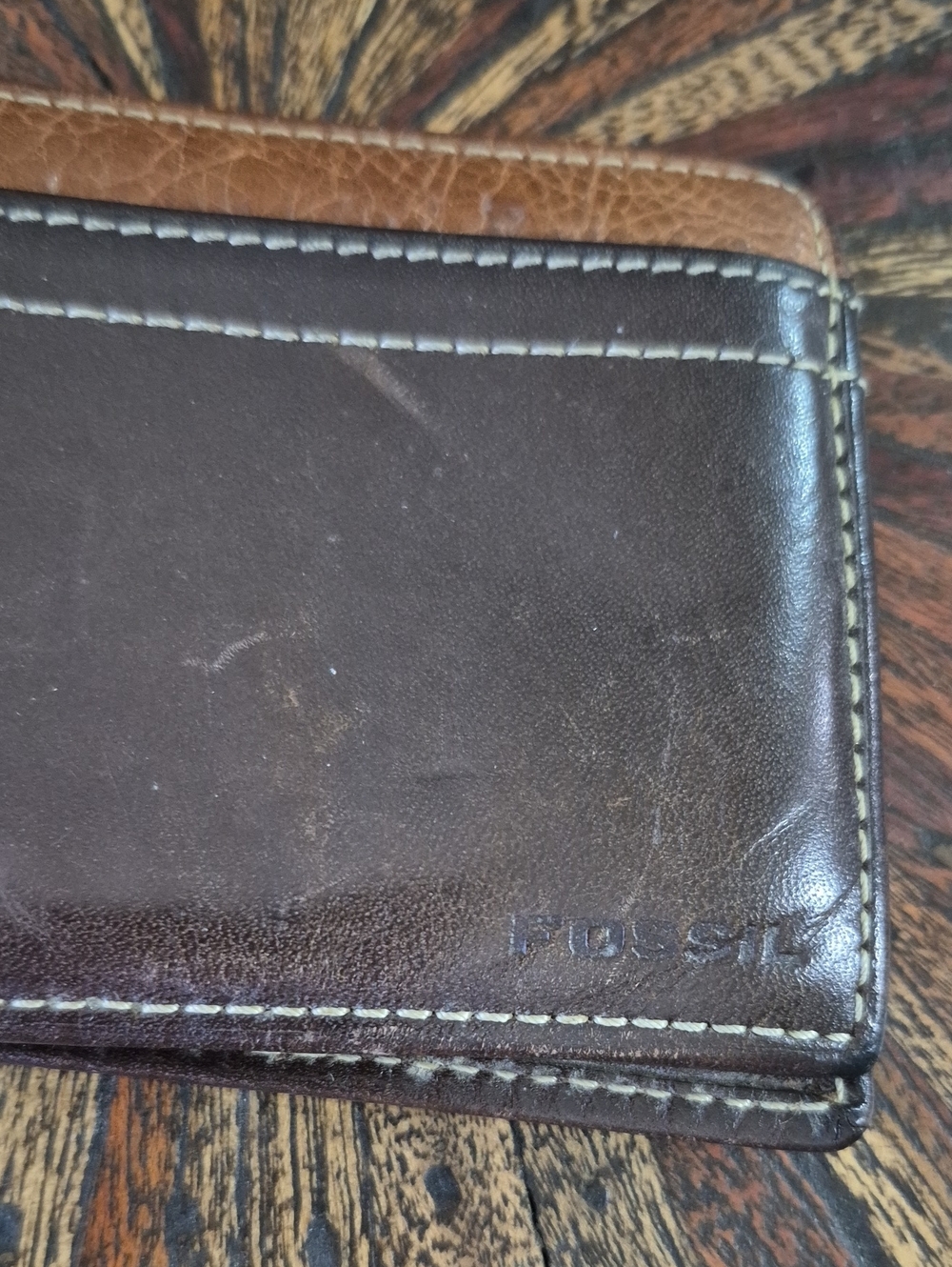 Fossil Brown and Tan Leather Bifold Wallet.